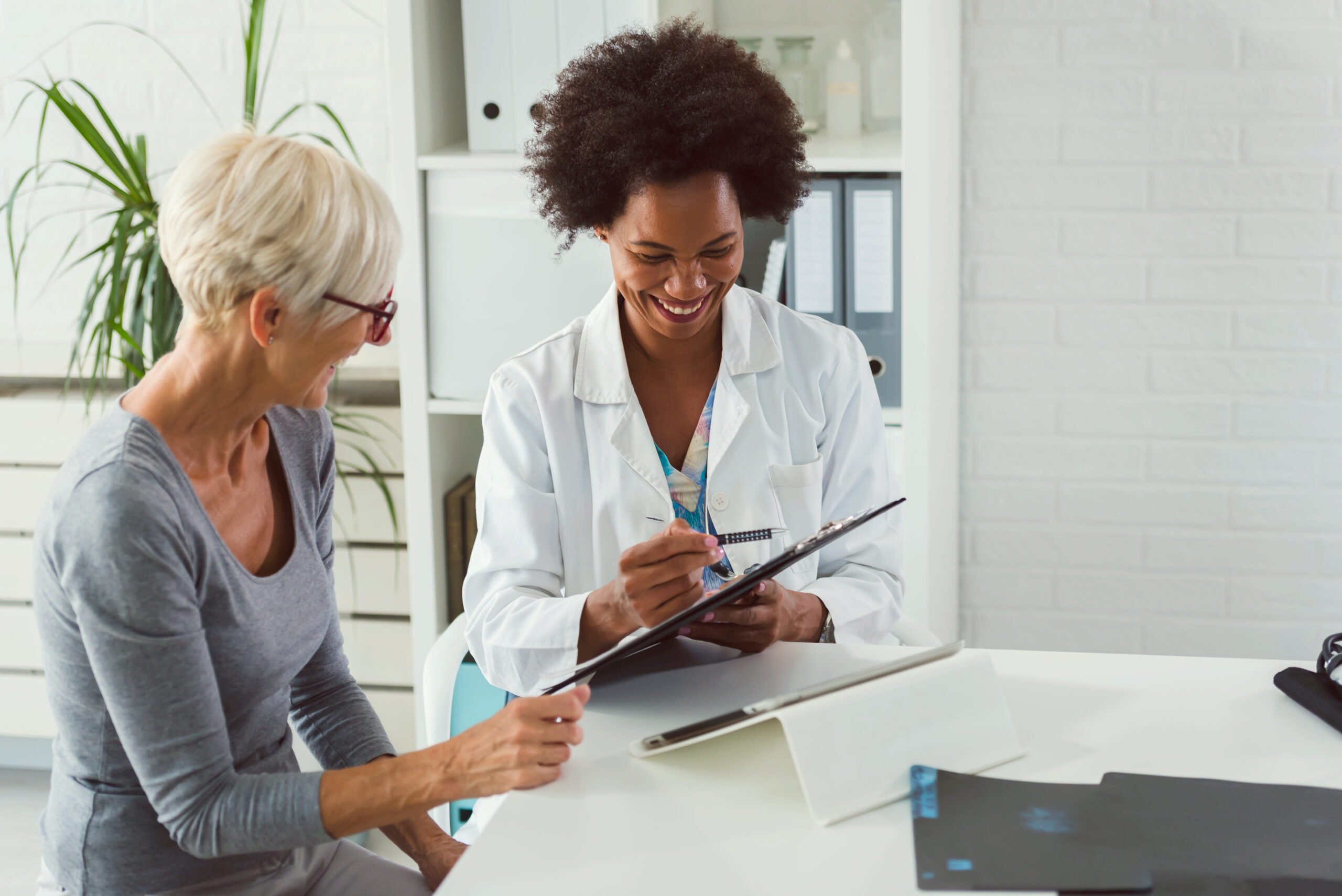 Doctor speaking with elderly patient