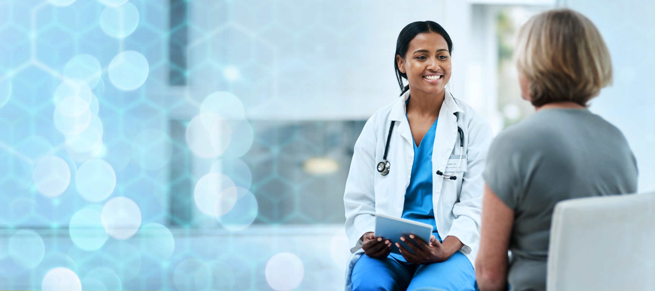 Older woman speaking with doctor at the hospital